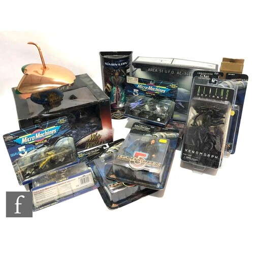 A collection of science fiction related toys, comprising thr...
