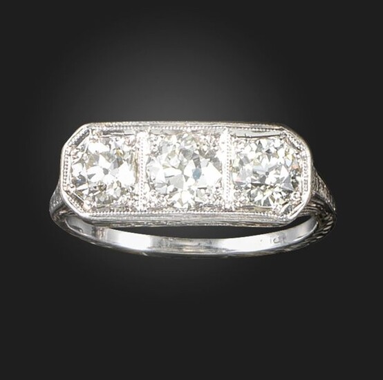 A diamond three stone ring, set with graduated old circular-cut...