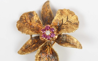 A gold, ruby and colourless gem set brooch, designed as a flowerhead, detailed ‘14’, wei