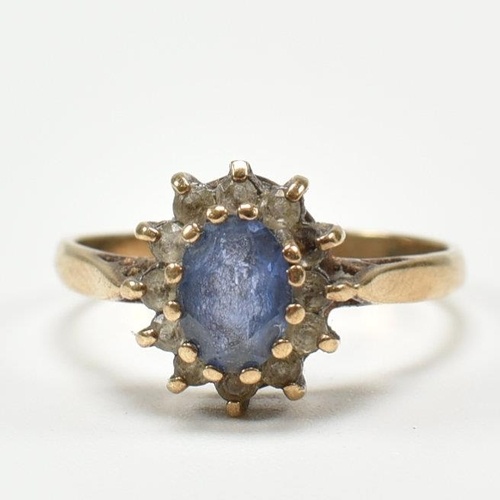 A hallmarked 9ct yellow gold & synthetic sapphire halo ring....