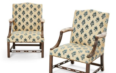 A pair of George III style mahogany library armchairs