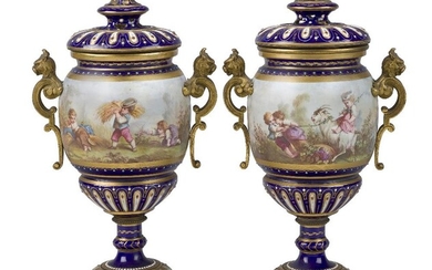 A pair of Sevres-style gilt-bronze mounted pot-pourri vases and covers, late 19th century, the bodies decorated with children in continuous landscapes at various activities including harvesting, watering and a riding goat, the blue-ground...