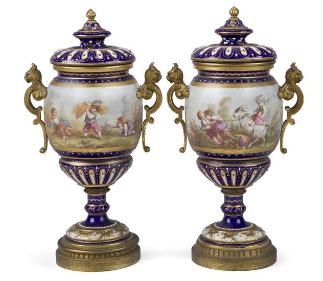 A pair of Sevres-style gilt-bronze mounted pot-pourri vases and covers, late 19th century, the bodies decorated with children in continuous landscapes at various activities including harvesting, watering and a riding goat, the blue-ground...