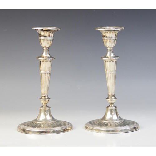A pair of late Victorian silver candlesticks, Harrison Broth...