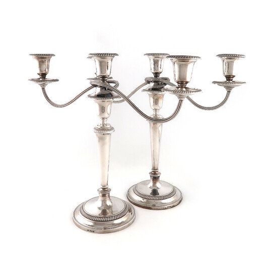 A pair of modern silver three-light candelabra