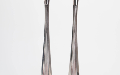 A pair of nickel silver candlesticks, mid 20th century.