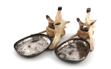 A pair of novelty metalware-mounted vertebrae dishes