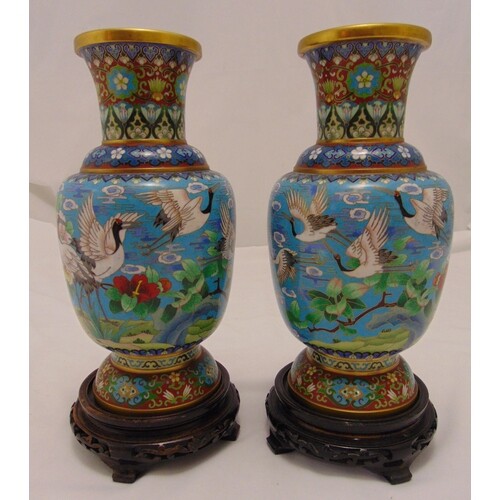 A pair of oriental cloisonné vases of baluster form, the sid...