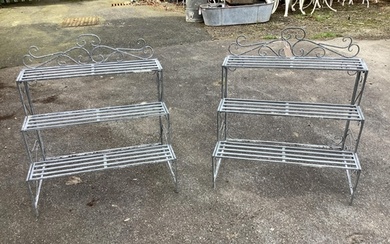 A pair of painted metal three tier pot stands, width 77cm, d...