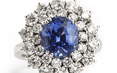 A sapphire and diamond ring set with an oval-cut natural Ceylon sapphire weighing 3.92 ct. and brilliant-cut diamonds weighing 2.30 ct., mounted in platinum.