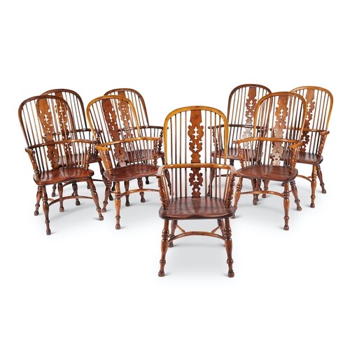 A set of eight late 19th/early 20th century yew-wood windsor...