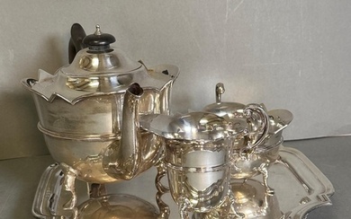 A three piece silver tea service to include a teapot, milk j...