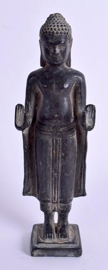 AN EARLY 20TH CENTURY CAMBODIAN KHMER BRONZE FIGURE OF