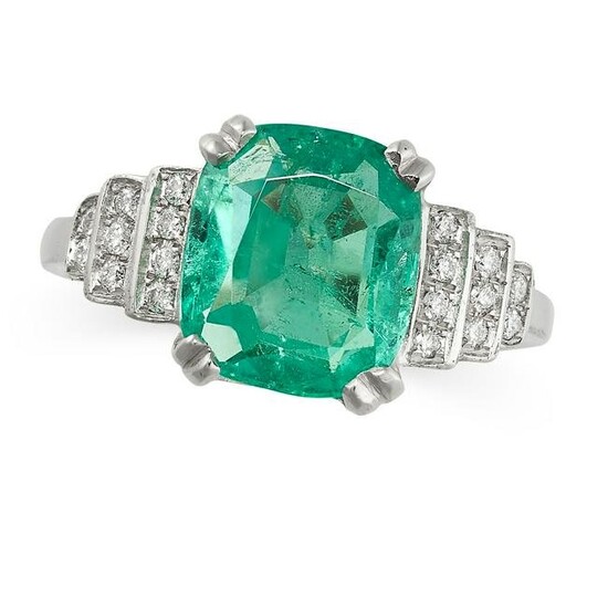 AN EMERALD AND DIAMOND DRESS RING set with a cushion
