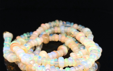 AN OPAL BEADED NECKLACE. VINTAGE OPAL ROUNDEL BEADS RECENTLY RESTRUNG. NECKLACE LENGTH 76cms.