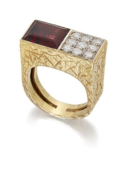 An 18ct gold, garnet and diamond ring...