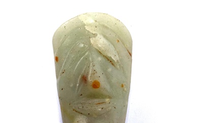 An Antique Chinese Carved Figural Green Stone Pendant with Russet Inclusions