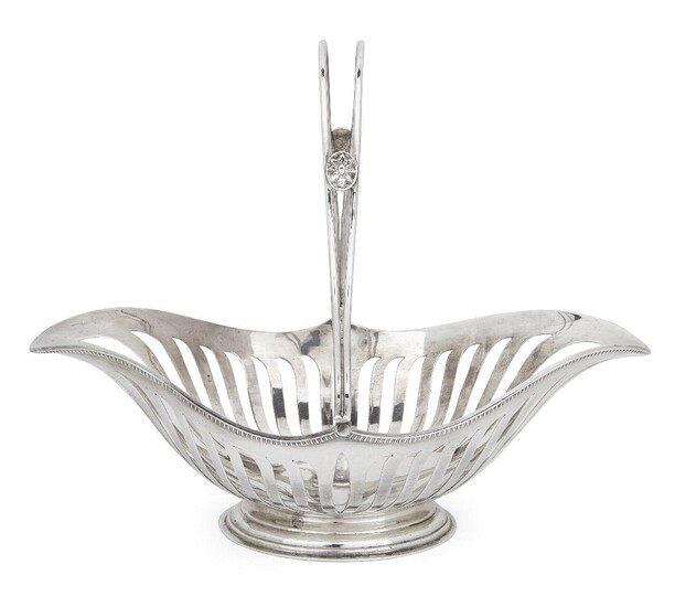 An Edwardian silver swing handled basket, London, 1909, Joseph Heming & Co., the openwork, navette-shaped basket raised on an oval foot, the split handle with medallion decoration to either side, 30cm long, 24.5cm high (inc. handle), approx. weight...