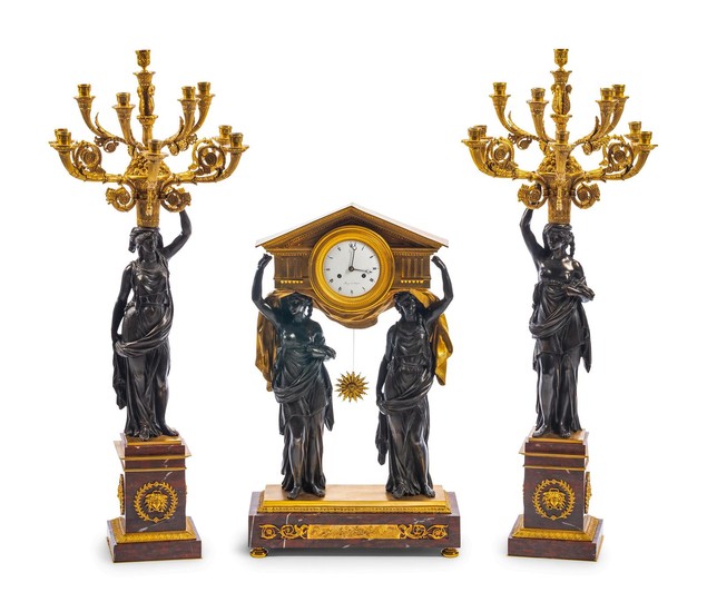 An Empire Gilt and Patinated Metal and Rouge Marble Three-Piece Figural Clock Garniture
