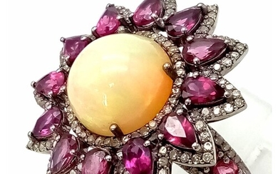 An Opal, Rhodolite and Diamond Flower Ring. A central opal s...