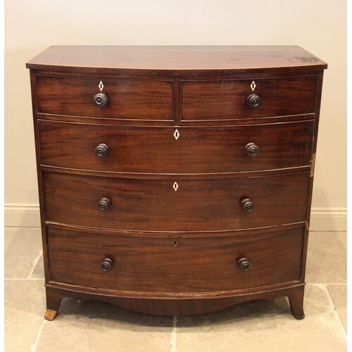 An early 19th century mahogany bow front chest of drawers, w...