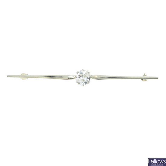 An early 20th century 18ct gold and platinum old-cut diamond bar brooch.