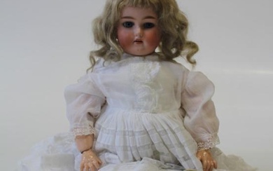 An early 20th century German bisque head doll. Head mould...