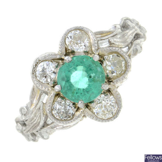 An emerald and old-cut diamond floral cluster ring.