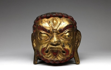 Arte Himalayana A large gilded copper embossed head of