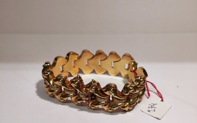 Bracelet en or jaune 18K (750°/°°) à mailles articulées et sa chainette de sécurité. poids:...