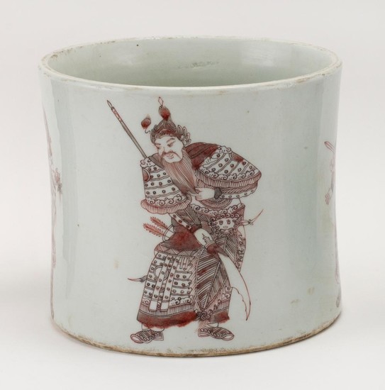 CHINESE RED AND WHITE PORCELAIN BRUSH POT With four warriors holding weaponry about the exterior. Six-character Kangxi mark on base....