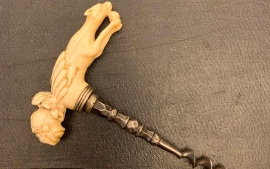 Corkscrew in steel fasté gone up with a handle of umbrella in ivory.