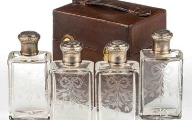 FRENCH 0.950 SILVER-MOUNTED ENGRAVED GLASS FOUR-PIECE BOTTLE SET IN ORIGINAL LEATHER CASE
