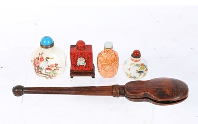 Four Asian cinnabar, porcelain, and reverse painted Peking glass snuff bottles and an antique