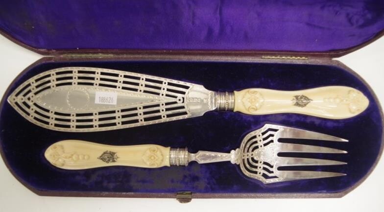 Good cased pair Victorian sterling silver servers London 1872,...