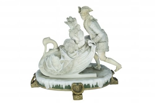 Group of statues Swan-shaped sleigh with seated checkers, in winter...