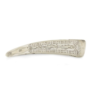 Inuit carved and incised walrus tusk cribbage board late...