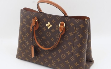 Louis Vuitton: a monogram leather Flower Tote bag, bearing date code AH1129 for March 2019, with metal flower escutcheon, three section interior including zipped central compartment and two pockets, with authenticity card and padlock in drawstring...