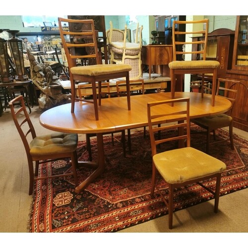 Mid-century extending dining room table with set of eight ma...