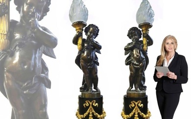 PAIR OF MONUMENTAL HENRY DASSON FIGURAL TORCHIERE LAMP