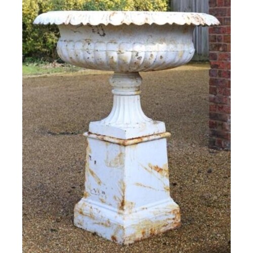 Pair of cast iron garden urns on stands, in the Georgian sty...