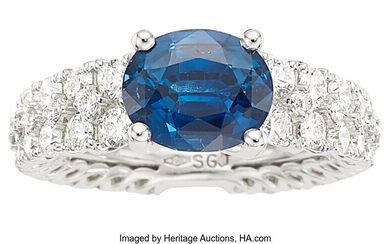 Sapphire, Diamond, White Gold Ring Stones: Oval-shaped sapphire weighing...
