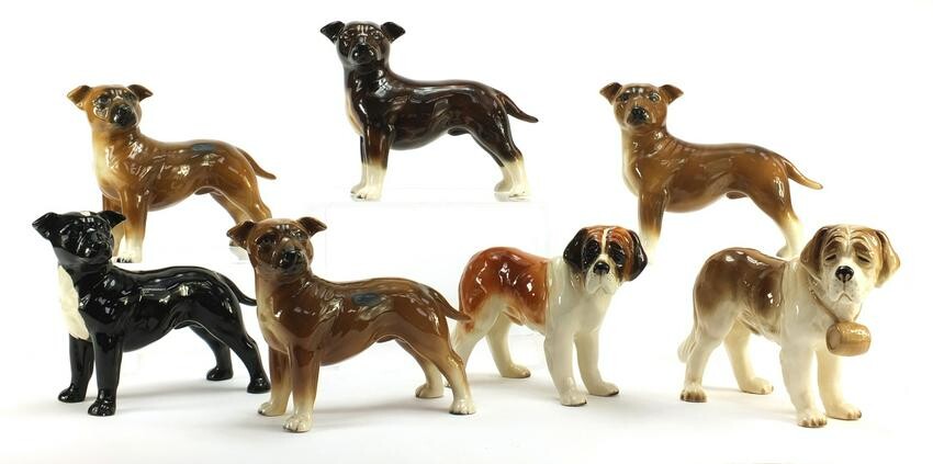 Seven Coopercraft hand painted porcelain dogs, each