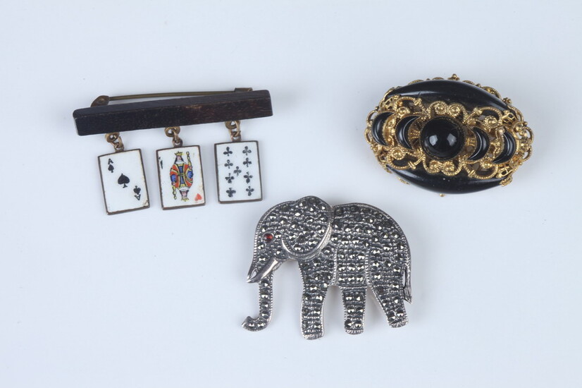 THREE ITEMS VINTAGE COSTUME JEWELRY. Including gilt scrolling openwork and...
