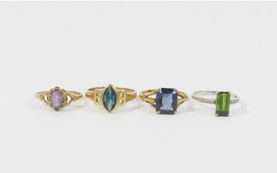 Three 9 carat gold single stone rings, and another stamped '...