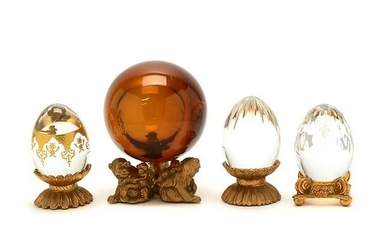 Three Baccarat Crystal Eggs and One Sphere, With