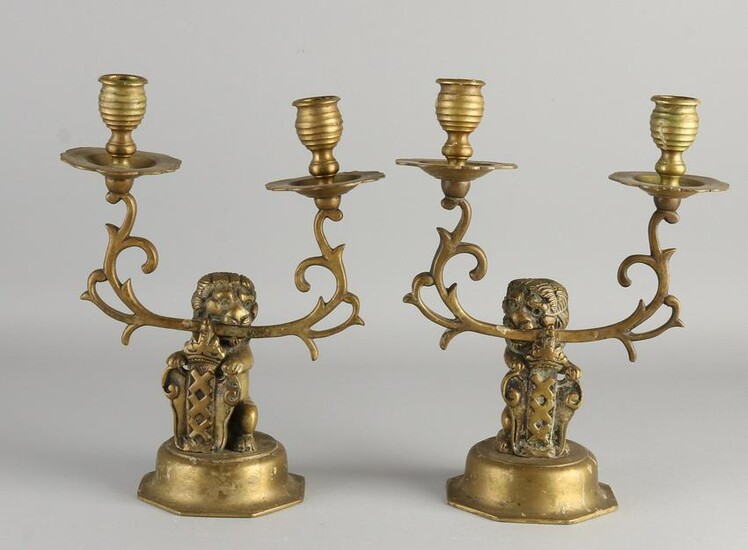 Two antique Dutch bronze candlesticks with Amsterdam
