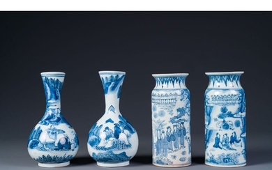 Two pairs of Japanese blue and white vases with figures in a...