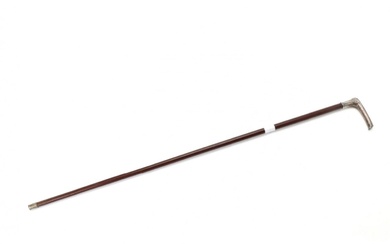Walking cane with a silver handle.