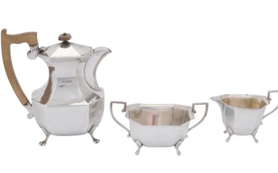 A silver canted rectangular hot water pot, cream jug and sugar basin by Viners